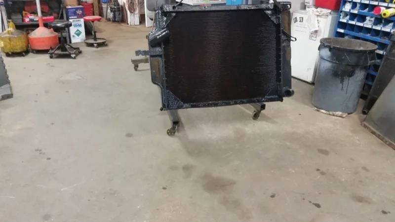 Radiator being serviced on a shop cart