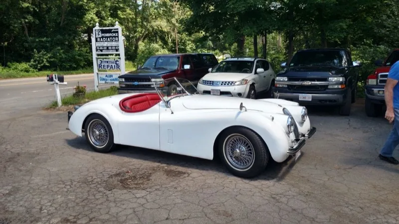 Classic white Jaguar roadster serviced by Pembroke Radiator